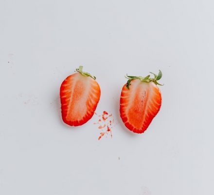 sliced strawberry on blue background